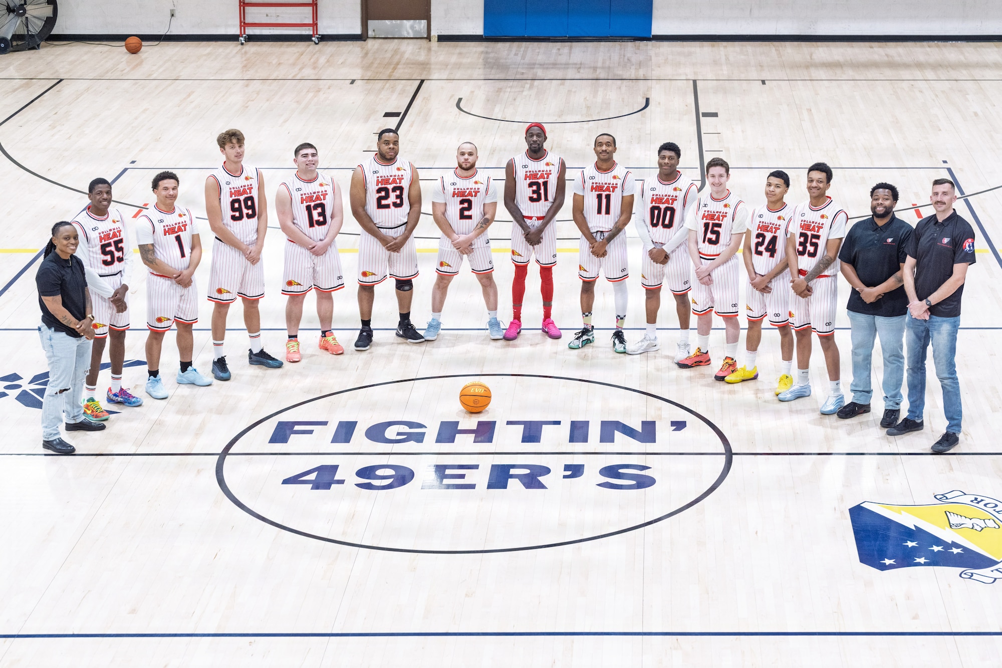 U.S. Air Force Senior Airman Dale Wallace II, Holloman Heat intramural basketball assistant coach and guard, second left, poses for a photo with his teammates at the Domenici Fitness Center gym on Holloman Air Force Base, New Mexico, Jan. 8, 2026.