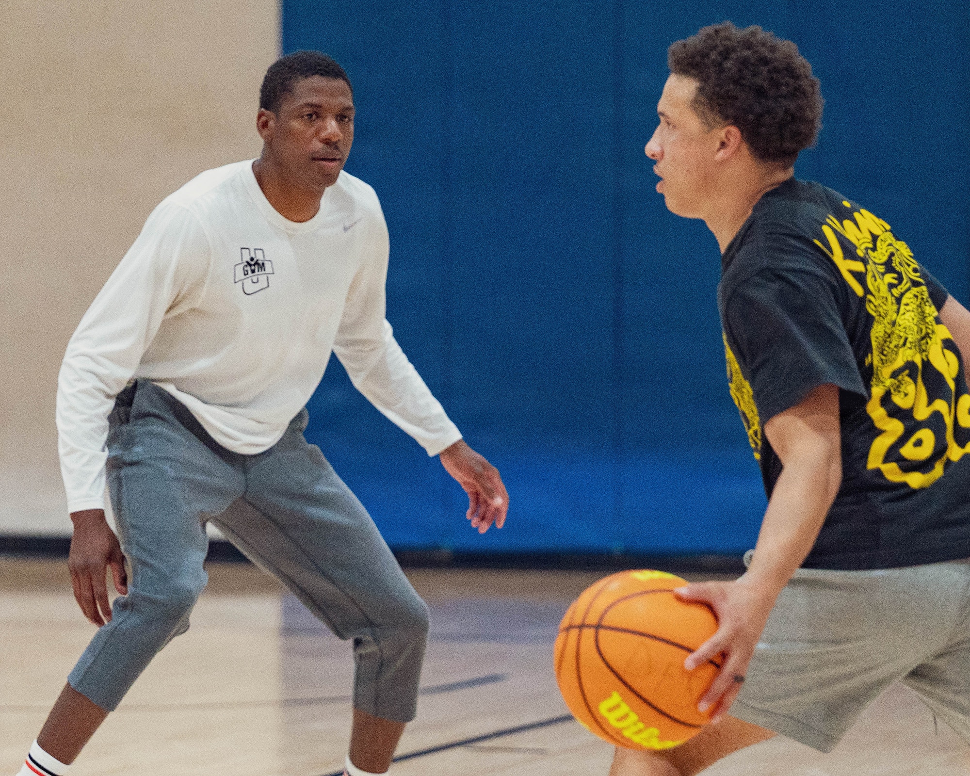 U.S. Air Force Senior Airman Dale Wallace II, Holloman Heat intramural basketball assistant conditioning coach, left, and U.S. Air Force Senior Airman Kerie Edmead, Holloman Heat intramural basketball guard, participate in a team practice session at Holloman Air Force Base, New Mexico, Jan. 8, 2026.