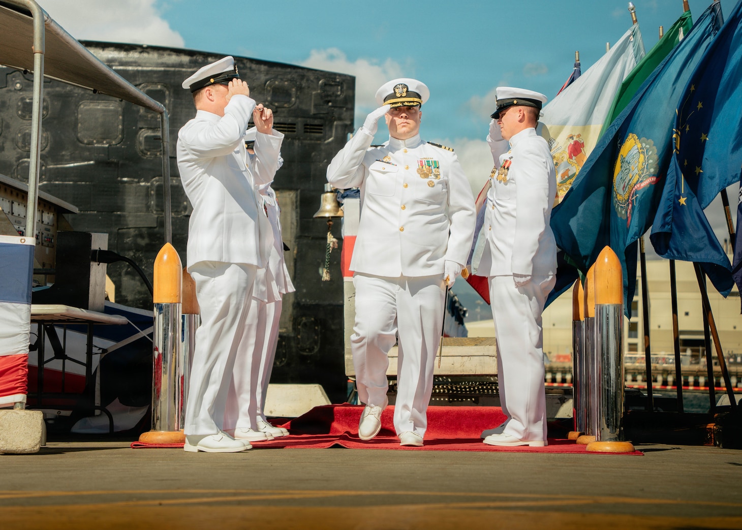 JOINT BASE PEARL HARBOR-HICKAM, Hawaii (Nov. 18, 2025) - Cmdr. Bill Murphy, commanding officer of Los Angeles-class fast-attack submarine USS Columbia (SSN 771), departs the change of command ceremony for Columbia at Joint Base Pearl Harbor-Hickam, Hawaii, Nov. 18, 2025. Columbia is assigned to Submarine Squadron 7 and is capable of supporting various missions, including anti-submarine warfare, anti-surface ship warfare, strike warfare, special operations forces support, and intelligence, surveillance, and reconnaissance. (U.S. Navy photo by Mass Communication Specialist 2nd Class Nicholas Russell)