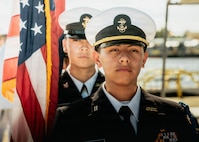 JOINT BASE PEARL HARBOR-HICKAM, Hawaii (Nov. 18, 2025) - Admiral Arthur W. Radford High School Navy Junior Reserve Officer Training Corps parade the colors during a change command ceremony for Los Angeles-class fast-attack submarine USS Columbia (SSN 771), at Joint Base Pearl Harbor-Hickam, Hawaii, Nov. 18, 2025. Columbia is assigned to Submarine Squadron 7 and is capable of supporting various missions, including anti-submarine warfare, anti-surface ship warfare, strike warfare, special operations forces support, and intelligence, surveillance, and reconnaissance. (U.S. Navy photo by Mass Communication Specialist 2nd Class Nicholas Russell)
