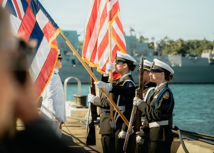 JOINT BASE PEARL HARBOR-HICKAM, Hawaii (Nov. 18, 2025) - Admiral Arthur W. Radford High School Navy Junior Reserve Officer Training Corps present the colors during a change command for Los Angeles-class fast-attack submarine USS Columbia (SSN 771), at Joint Base Pearl Harbor-Hickam, Hawaii, Nov. 18, 2025. Columbia is assigned to Submarine Squadron 7 and is capable of supporting various missions, including anti-submarine warfare, anti-surface ship warfare, strike warfare, special operations forces support, and intelligence, surveillance, and reconnaissance. (U.S. Navy photo by Mass Communication Specialist 2nd Class Nicholas Russell)