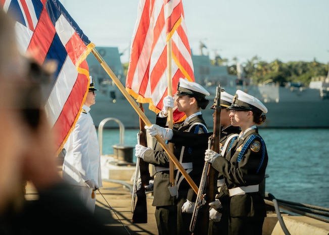 JOINT BASE PEARL HARBOR-HICKAM, Hawaii (Nov. 18, 2025) - Admiral Arthur W. Radford High School Navy Junior Reserve Officer Training Corps present the colors during a change command for Los Angeles-class fast-attack submarine USS Columbia (SSN 771), at Joint Base Pearl Harbor-Hickam, Hawaii, Nov. 18, 2025. Columbia is assigned to Submarine Squadron 7 and is capable of supporting various missions, including anti-submarine warfare, anti-surface ship warfare, strike warfare, special operations forces support, and intelligence, surveillance, and reconnaissance. (U.S. Navy photo by Mass Communication Specialist 2nd Class Nicholas Russell)