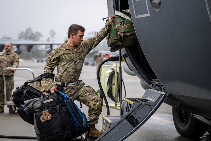A U.S. Airman loads luggage onto an HC-130J Combat King II to prepare for a deployment at Moody Air Force Base, Georgia, Dec. 8, 2025. U.S. military forces are deployed to the Caribbean in support of Operation Southern Spear, the U.S. Southern Command mission, Department of War-directed operations and the president’s priorities to disrupt illicit drug trafficking and protect the homeland. (U.S. Air Force photo)