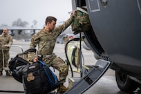 A U.S. Airman loads luggage onto an HC-130J Combat King II to prepare for a deployment at Moody Air Force Base, Georgia, Dec. 8, 2025. U.S. military forces are deployed to the Caribbean in support of Operation Southern Spear, the U.S. Southern Command mission, Department of War-directed operations and the president’s priorities to disrupt illicit drug trafficking and protect the homeland. (U.S. Air Force photo)