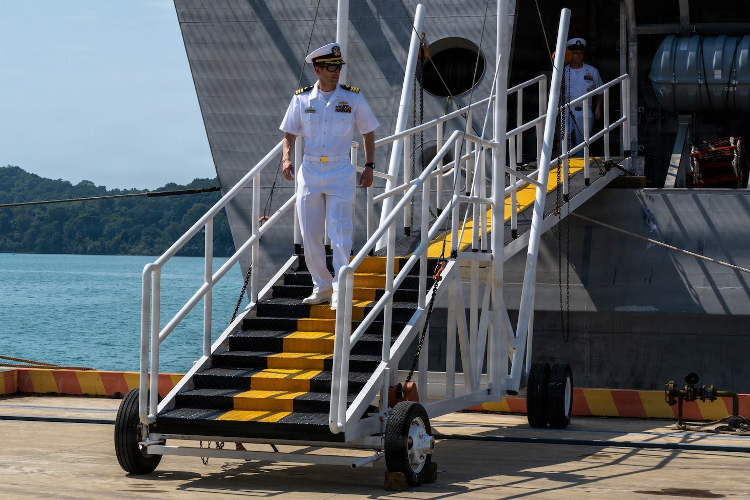 Cmdr. Andrew Recame, commanding officer of Independence-Variant littoral combat ship USS Cincinnati (LCS 20) disembarks Cincinnati at Ream Naval Base, Cambodia, Jan. 24.