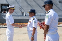 Cmdr. Andrew Recame, commanding officer of Independence-Variant littoral combat ship USS Cincinnati (LCS 20) meets with Radm. Chong Sideth, Chief of Staff and Deputy Commander of Ream Naval Base, Cambodia, Jan. 24.