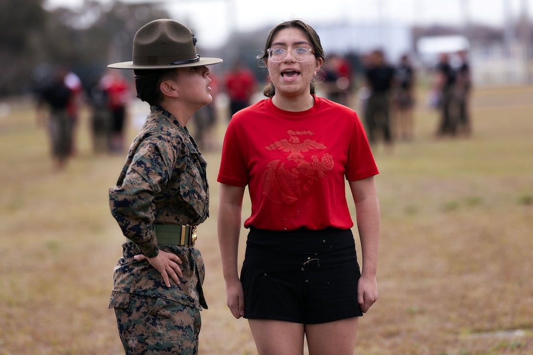 U.S. Marine Corps Sgt. Daisy Espitia, a drill instructor from Marine Corps Recruit Depot Parris Island, gives orders during a poolee function Jan. 24, 2026, at Marine Corps Support Facility Blount Island, Florida. The event, hosted by Marine Corps Recruiting Station Jacksonville and supported by drill instructors from Marine Corps Recruit Depot Parris Island in South Carolina, tested the physical and mental readiness of future Marines as part of their preparation for recruit training. (Official Marine Corps photo by Dustin Senger)