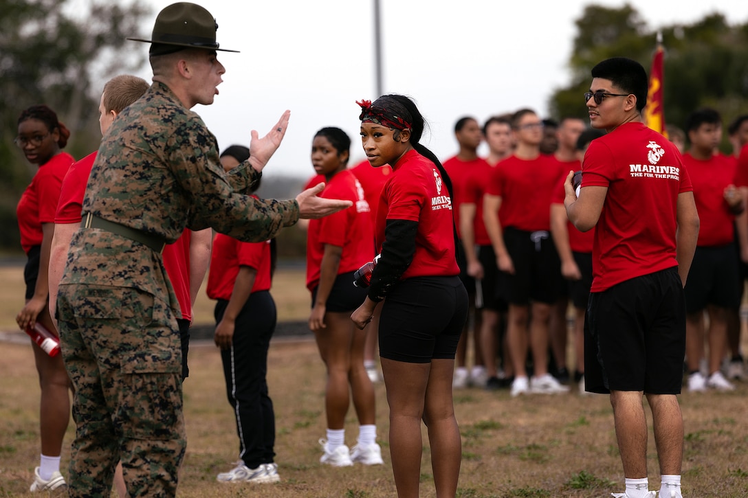 U.S. Marine Corps Sgt. John Lawson, a drill instructor from Marine Corps Recruit Depot Parris Island, gives orders during a poolee function Jan. 24, 2026, at Marine Corps Support Facility Blount Island, Florida. The event, hosted by Marine Corps Recruiting Station Jacksonville and supported by drill instructors from Marine Corps Recruit Depot Parris Island in South Carolina, tested the physical and mental readiness of future Marines as part of their preparation for recruit training. (Official Marine Corps photo by Dustin Senger)