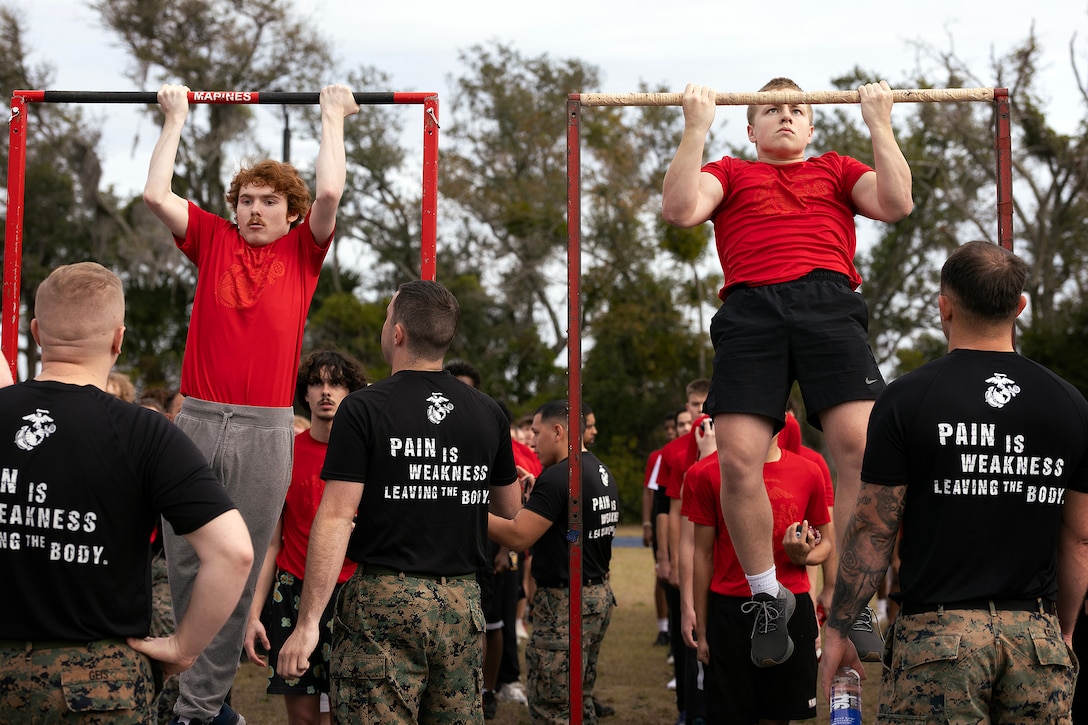 Young men and women from across Georgia and Florida complete a pull-up challenge during a poolee function Jan. 24 at Marine Corps Support Facility Blount Island, Florida. The event, hosted by Marine Corps Recruiting Station Jacksonville and supported by drill instructors from Marine Corps Recruit Depot Parris Island in South Carolina, tested the physical and mental readiness of future Marines as part of their preparation for recruit training. (Official Marine Corps photo by Dustin Senger)