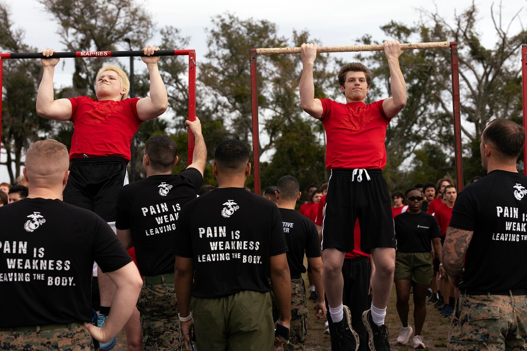 Young men and women from across Georgia and Florida complete a pull-up challenge during a poolee function Jan. 24 at Marine Corps Support Facility Blount Island, Florida. The event, hosted by Marine Corps Recruiting Station Jacksonville and supported by drill instructors from Marine Corps Recruit Depot Parris Island in South Carolina, tested the physical and mental readiness of future Marines as part of their preparation for recruit training. (Official Marine Corps photo by Dustin Senger)