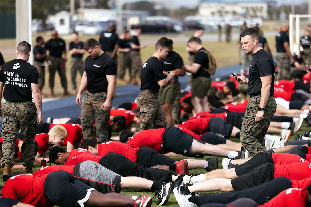 Young men and women from across Georgia and Florida complete a timed plank hold during a poolee function Jan. 24 at Marine Corps Support Facility Blount Island, Florida. The event, hosted by Marine Corps Recruiting Station Jacksonville and supported by drill instructors from Marine Corps Recruit Depot Parris Island in South Carolina, tested the physical and mental readiness of future Marines as part of their preparation for recruit training. (Official Marine Corps photo by Dustin Senger)
