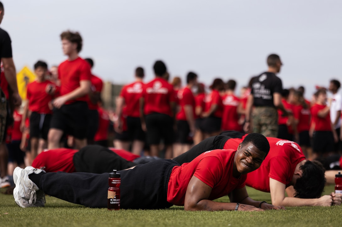Young men and women from across Georgia and Florida complete a timed plank hold during a poolee function Jan. 24 at Marine Corps Support Facility Blount Island, Florida. The event, hosted by Marine Corps Recruiting Station Jacksonville and supported by drill instructors from Marine Corps Recruit Depot Parris Island in South Carolina, tested the physical and mental readiness of future Marines as part of their preparation for recruit training. (Official Marine Corps photo by Dustin Senger)