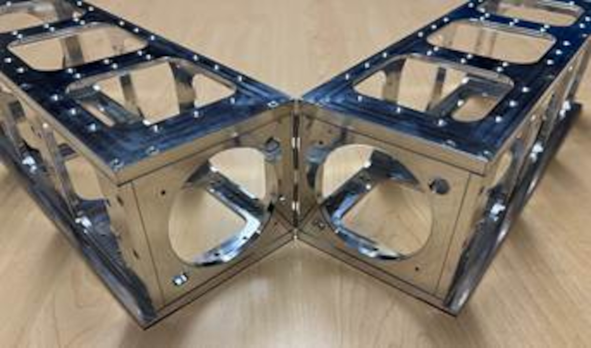 Articulating Spacecraft Chassis Accommodates Enhanced Payloads