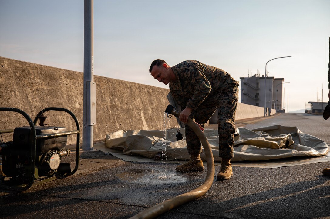 U.S. Marine Corps Maj. Gen. Brian Wolford, the commanding general of Marine Corps Installations Pacific, drinks purified water during water purification training as part of exercise Nankai Rescue 2026 at Marine Corps Air Station Iwakuni, Japan, Jan. 24, 2026. Exercise Nankai Rescue 2026 is a full-scale exercise focused on enhancing the bilateral coordination between the U.S. and Japan in support of humanitarian and disaster relief efforts. (U.S. Marine Corps photo by Sgt. Peter Rawlins)
