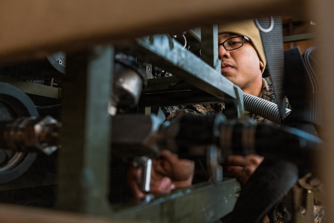 U.S. Marine Corps Lance Cpl. Nicholaus Nena, a water support technician with Marine Wing Support Squadron (MWSS) 171, Marine Aircraft Group 12, 1st Marine Aircraft Wing, and a native of Virginia Beach, Virginia, adjusts the water pressure in a water purification system during Exercise Nankai Rescue at Marine Corps Air Station Iwakuni, Japan, Jan. 24, 2026. Exercise Nankai Rescue is a full-scale exercise focused on enhancing the bilateral coordination between the U.S. and Japan in support of humanitarian and disaster relief efforts. (U.S. Marine Corps photo by Cpl. Sarah Grawcock)