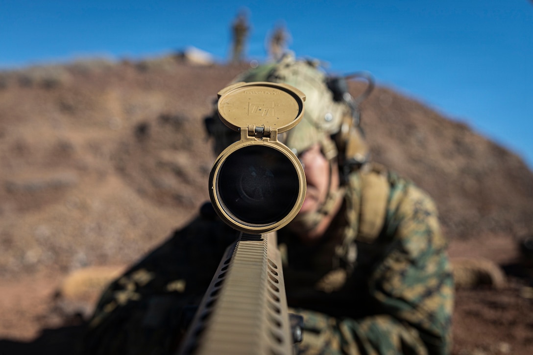 U.S. Marine Corps Sgt. Nigel Palmer, a team leader with 3rd Littoral Combat Team, 3rd Marine Littoral Regiment, 3rd Marine Division, observes simulated targets with a Mark 22 precision sniper rifle during a live-fire range at Pohakuloa Training Area, Hawaii, Jan. 19, 2026.