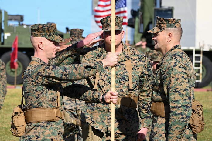 U.S. Marine Corps Lt. Col. David Janecke, right, outgoing commanding officer of 3rd Maintenance Battalion, 3rd Marine Logistics Group, passes the unit colors to Lt. Col. John Sykas III, the incoming commanding officer of 3rd Maintenance Battalion, 3rd MLG, during a change of command ceremony at Camp Kinser, Okinawa, Japan, Jan. 16, 2026. Lt. Col. David Janecke relinquished command of 3rd Maintenance Battalion to Lt. Col. John Sykas III. (U.S. Marine Corps photo by Lance Cpl. Rachel Mason)