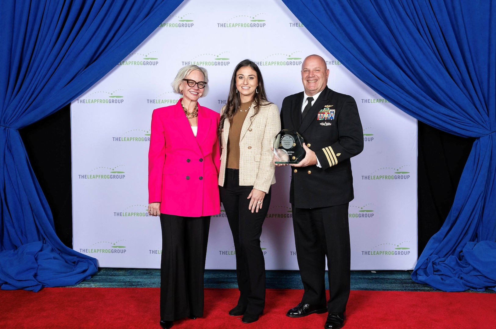From right to left, Commander Carlton Bennett III and Mrs. Chelsea Mull, representing Naval Health Clinic Cherry Point, accept The Leapfrog Group’s award for Top Ambulatory Surgery Center from Mrs. Leah Binder, President and CEO of The Leapfrog Group, left, during a ceremony held Monday, December 15, 2025.  

The recognition, according to a press announcement by the Leapfrog Group published December 15, 2025, “honors top hospitals and ASCs that demonstrate the highest performance in the nation on quality and patient safety, including ethical billing and informed patient consent procedures, lower infection rates, prevention of medication errors and surgical safety.”