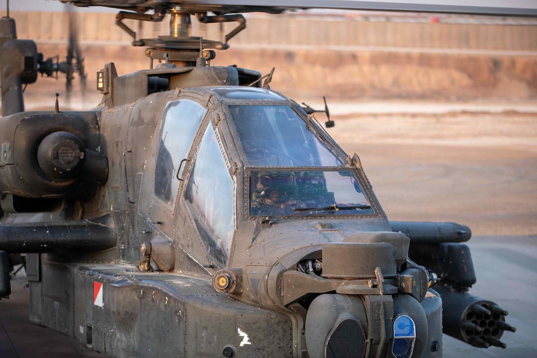 An AH-64 Apache attack helicopter prepares for take-off in the U.S. Central Command Area of Responsibility on Nov. 5, 2025. Apache attack helicopters are primarily used for precision strikes, close air support, and air reconnaissance. (U.S. Army Photo by Capt. Bernard Jenkins Jr.)
