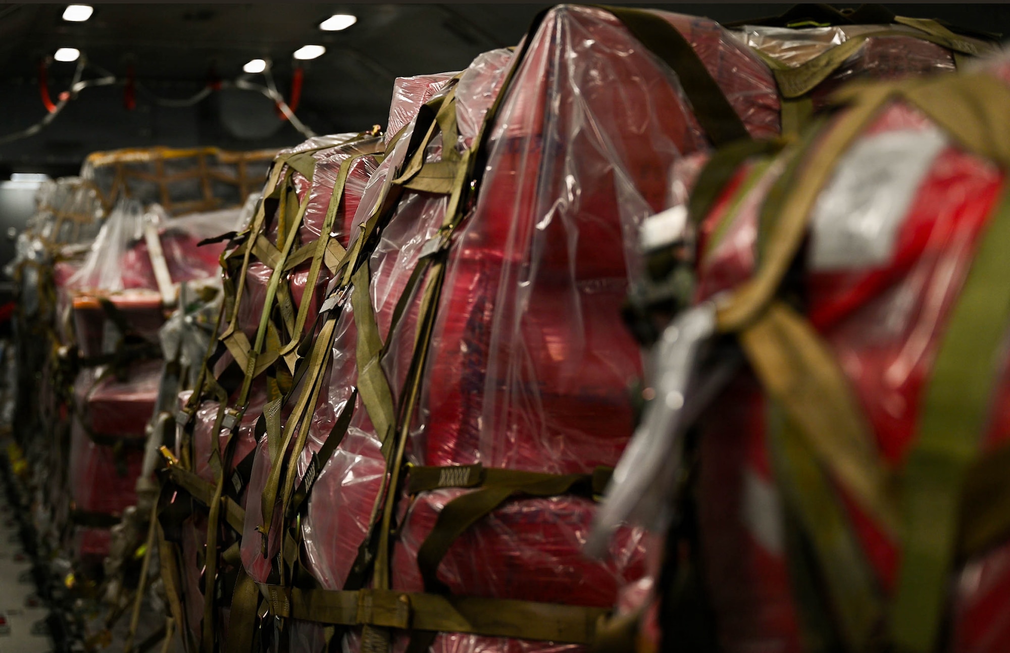 Pallets of cargo sit in a row on a KC-46A Pegasus aircraft