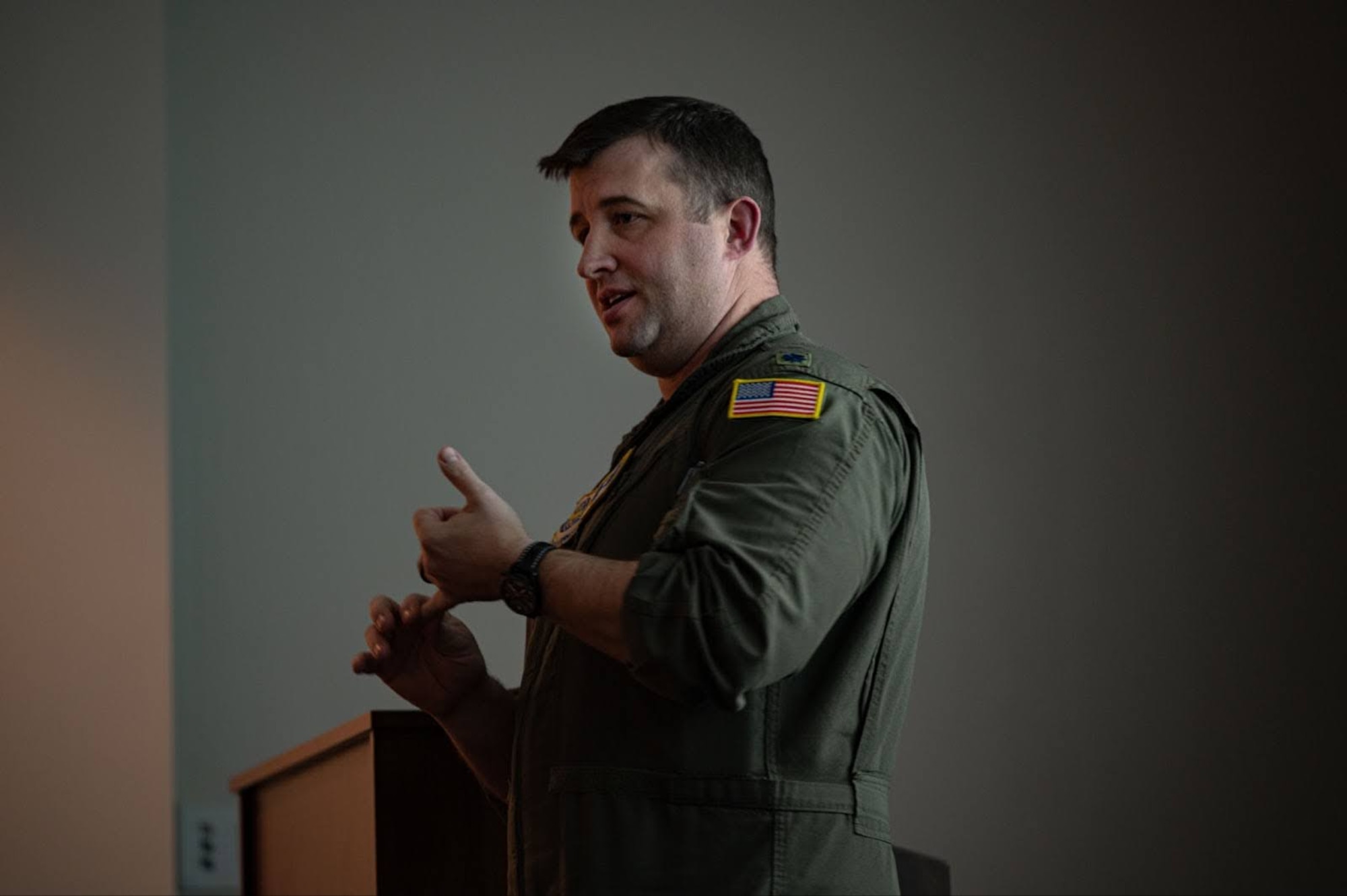 U.S. Air Force Lt. Col. Barrett Meysembourg, Air Mobility Command branch chief, briefs Total Force senior leaders from multiple U.S. Air Force entities during the KC-46 Weapons Systems Council at Joint Base McGuire-Dix-Lakehurst, N.J., Dec. 9, 2025.