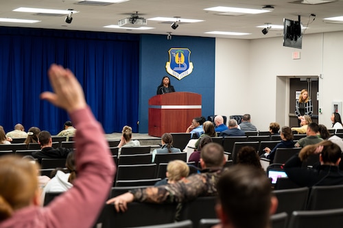 A Hunt Housing resident raises her hand to ask a question during a town hall meeting on Maxwell Air Force Base, Alabama, Jan. 21, 2026.