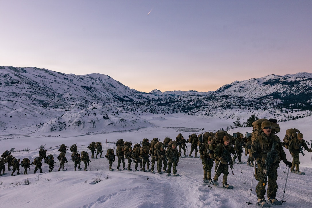 U.S. Marines with Fury Company, 2nd Battalion, 4th Marine Regiment, 1st Marine Division, hike during Mountain Training Exercise 1-26 at Marine Corps Mountain Warfare Training Center Bridgeport, California, Jan. 17, 2026. MTX is a month-long exercise designed to prepare units to survive and operate effectively in austere, mountainous terrain, further developing character, mental, spiritual and physical endurance and resiliency. (U.S. Marine Corps photo by Cpl. Vincent Needham)