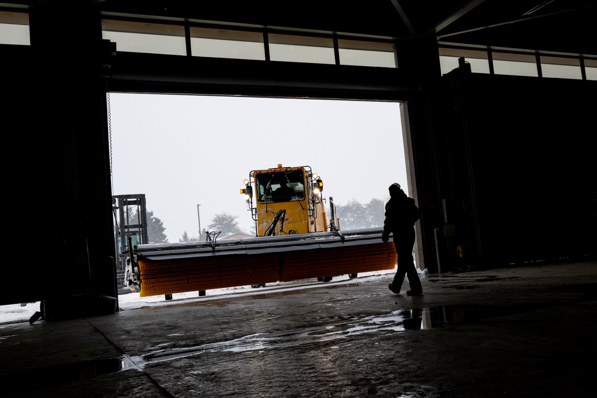 Photo of Andrews Airmen conducting snow removal operations