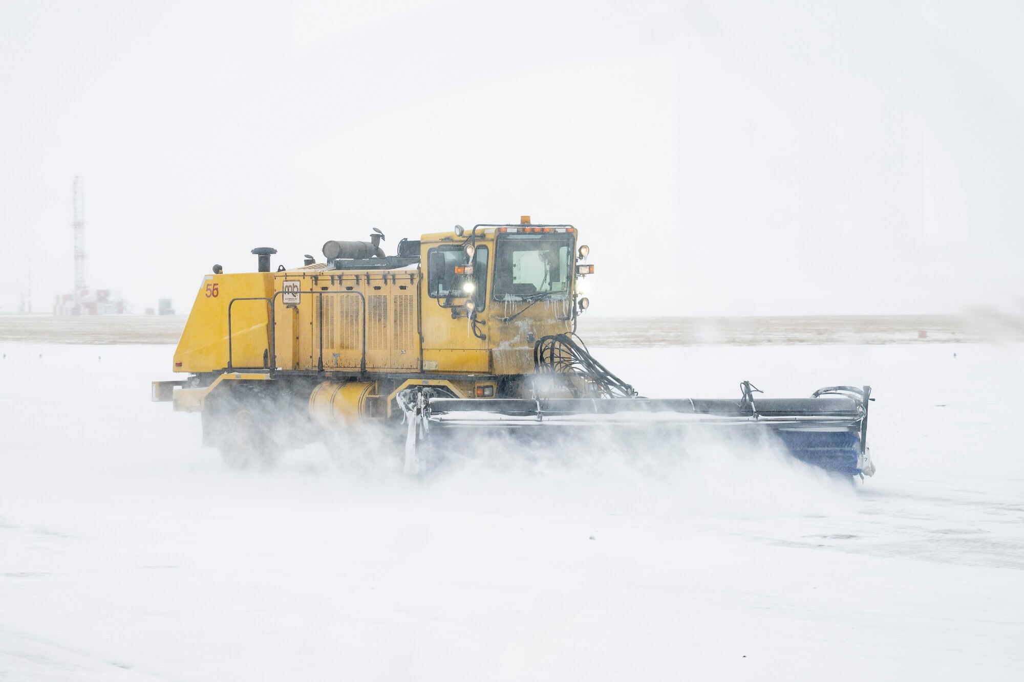 Photo of Andrews Airmen conducting snow removal operations