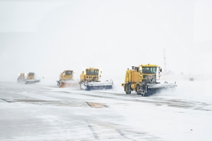 Photo of Andrews Airmen conducting snow removal operations