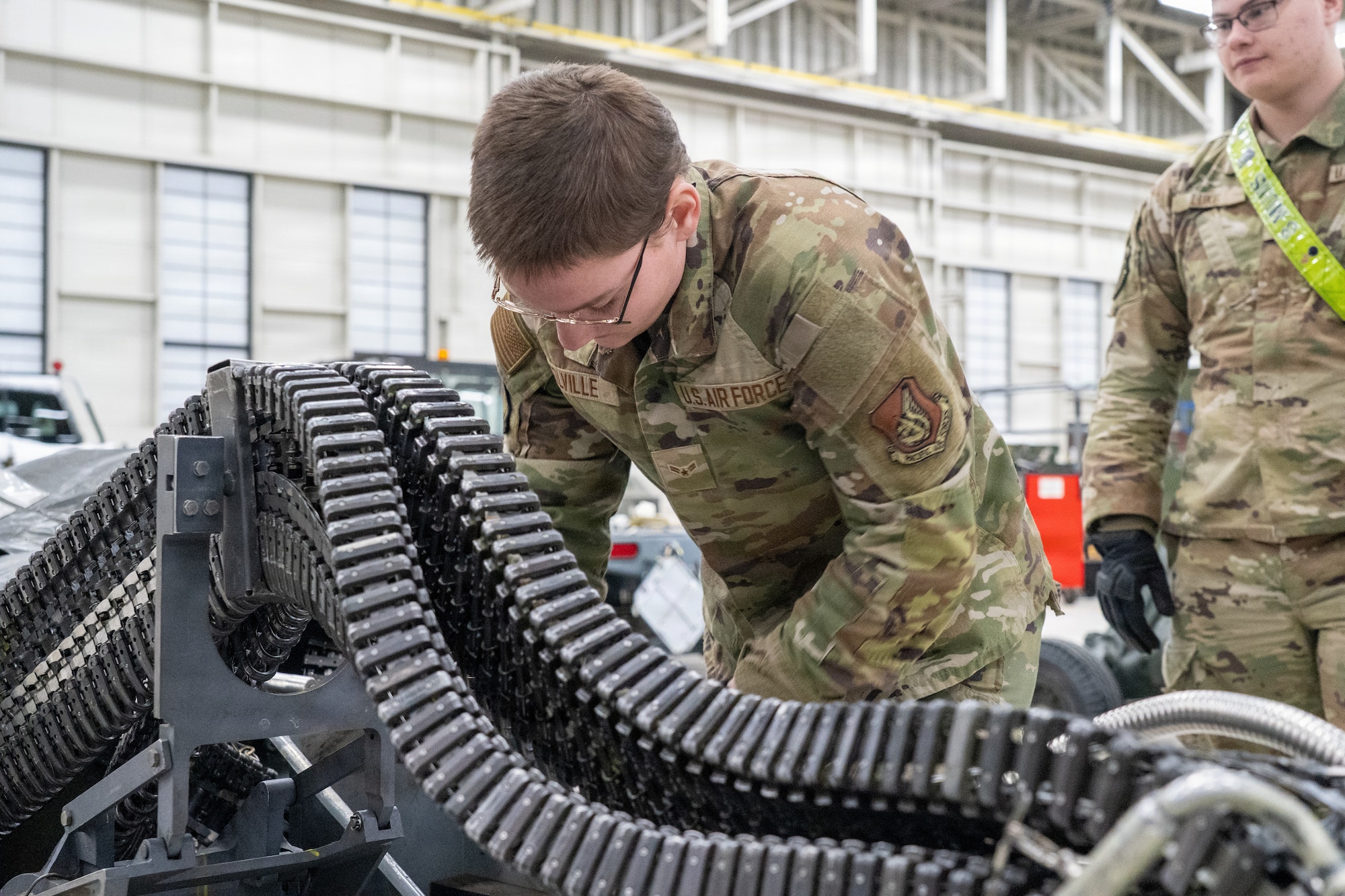 U.S. Air Force Airman 1st Class Natalie Colville, assigned to the 3rd Munitions Squadron, loads rounds of PGU-39A/B dummy ammunition during the annual Mission Generation Competition at Joint Base Elmendorf-Richardson, Alaska, Jan. 9, 2026.
