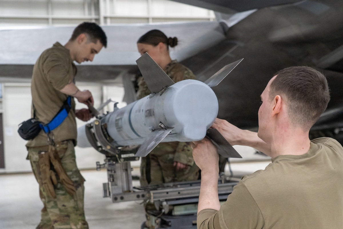 U.S. Air Force Airmen assigned to 525th Force Generation Squadron work on an AIM-120 AMRAAM during the annual Mission Generation Competition at Joint Base Elmendorf-Richardson, Alaska, Jan. 9, 2026.
