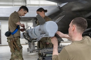 U.S. Air Force Airmen assigned to the 525th Force Generation Squadron adjust an AIM-9M during the annual Mission Generation Competition at Joint Base Elmendorf-Richardson, Alaska, Jan. 9, 2026.