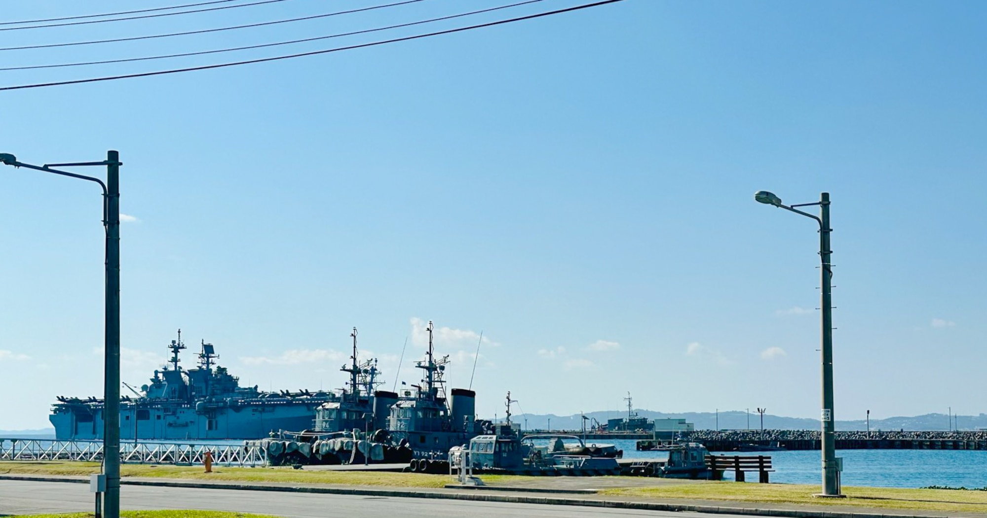 Vessels sit docked at a White Beach Naval Facility.