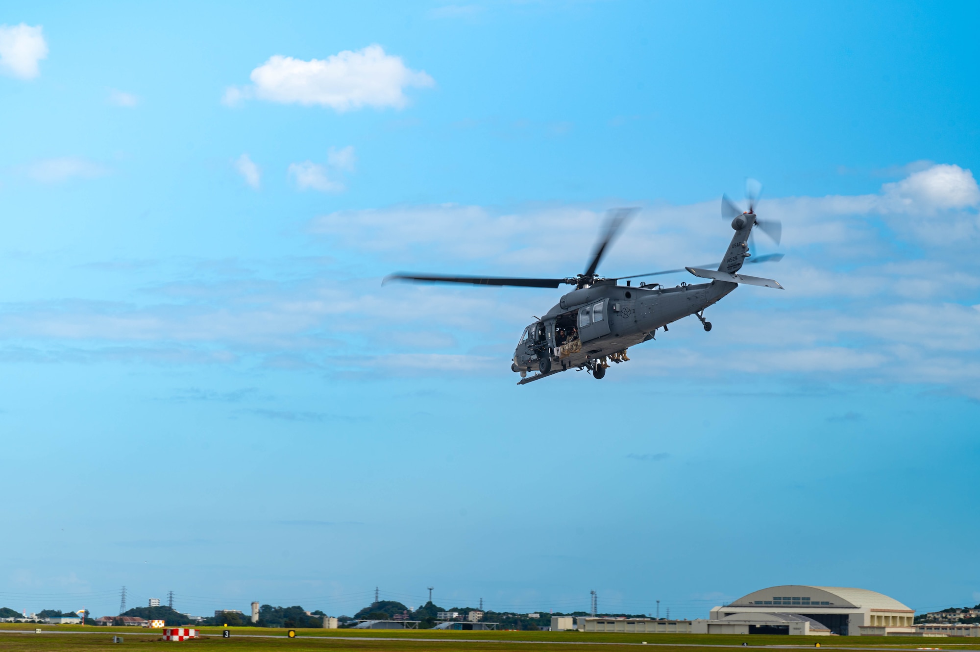 U.S. Air Force Airmen assigned to the 18th Operations Support Squadron weather flight, take off in an HH-60 Jolly Green II to Whiskey-174 from Kadena Air Base, Japan, Jan. 12, 2026. The 18th OSS Weather Flight operates continuously to deliver accurate, mission-critical forecasts for aircrews throughout the Indo-Pacific. (U.S. Air Force photo by Senior Airman Jamal Berry II)