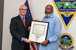 260121-N-DG679-1001 

JACKSONVILLE, Fla. – Fleet Readiness Center Southeast’s (FRCSE) Executive Director, Darrell White, presents Rodney McQueen, supervisor of preventive maintenance, with the Naval Air Systems Command’s Mentor of the Year award.