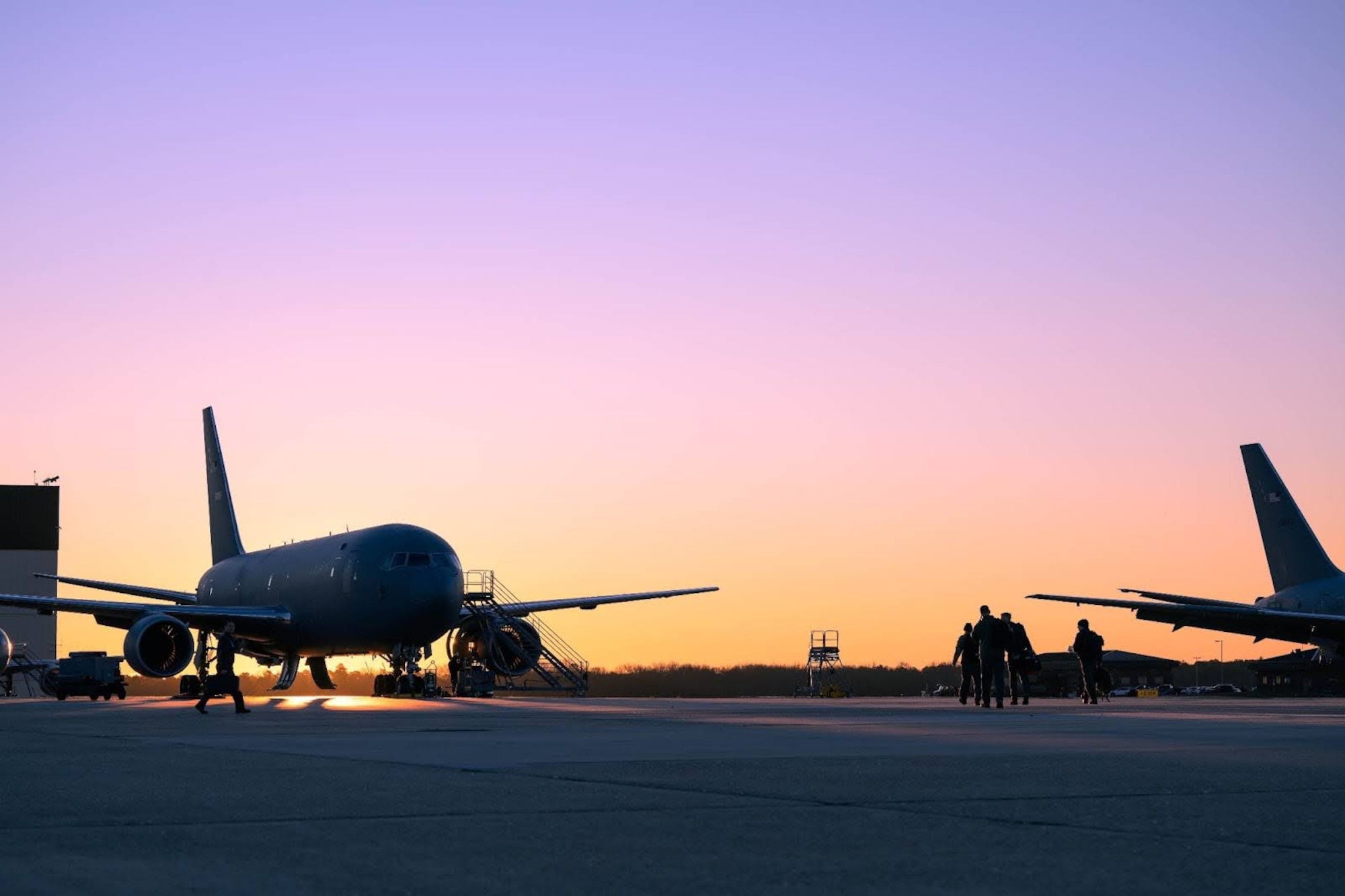 U.S. Air Force members walk out to a KC-46A Pegasus aircraft during Exercise Krampus at Joint Base McGuire-Dix-Lakehurst, N.J., Dec. 9, 2025.