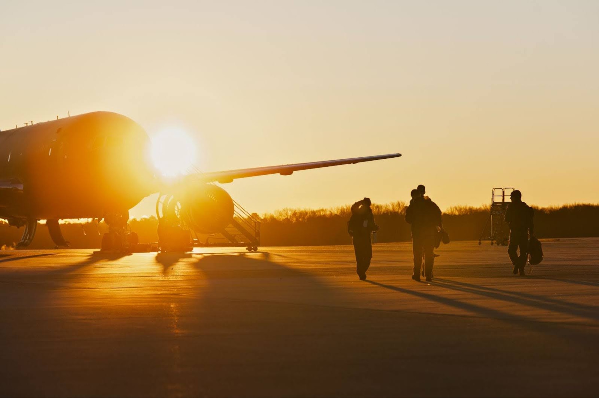 U.S. Air Force members walk out to a KC-46A Pegasus aircraft during Exercise Krampus at Joint Base McGuire-Dix-Lakehurst, N.J., Dec. 9, 2025.