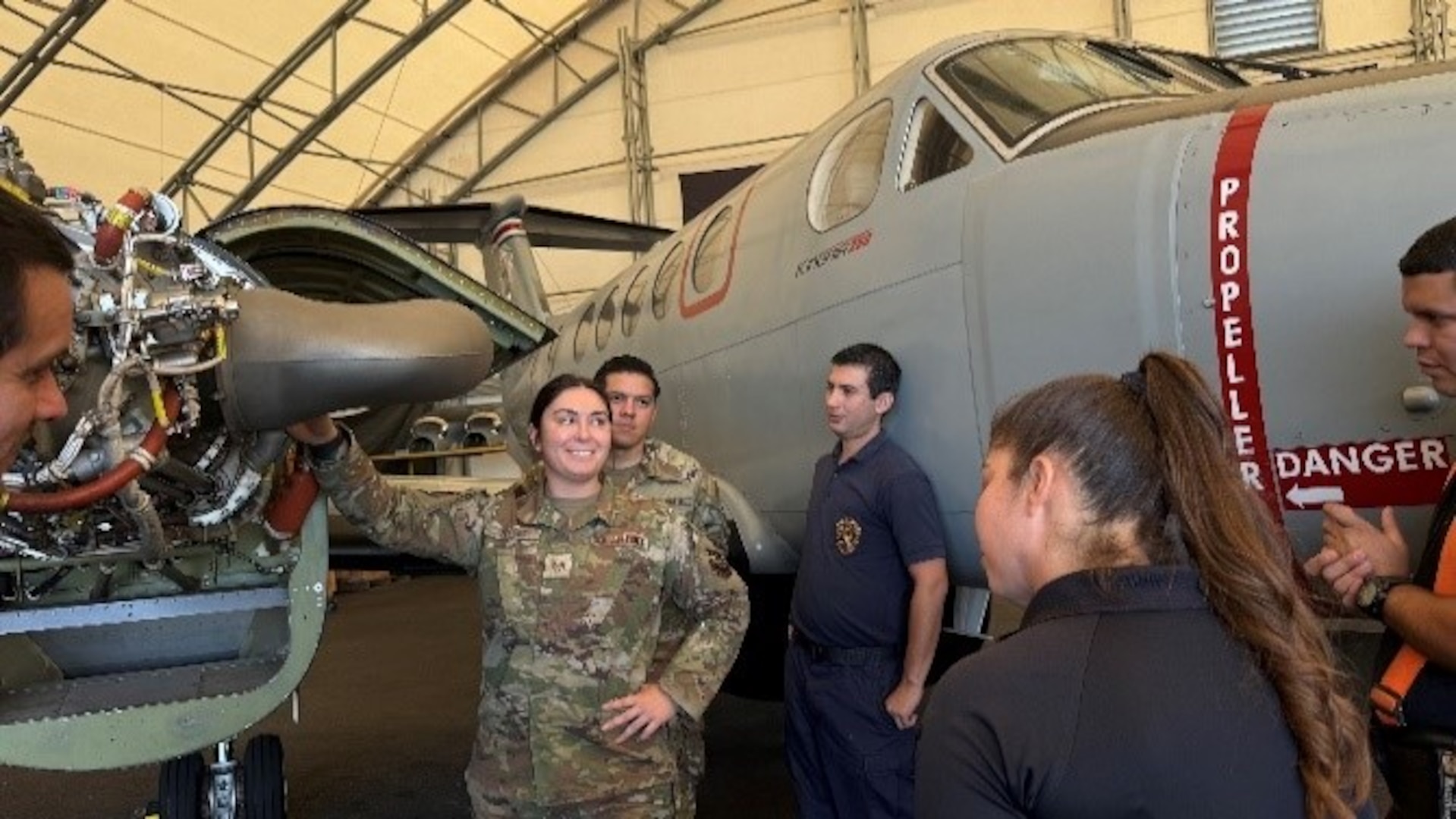 People stand near planes.