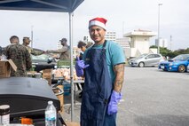 U.S. Marine Corps Staff Sgt. Jonathan Jacobo, a motor transport operations chief with Combat Logistics Regiment 37, 3rd Marine Logistics Group, poses for a photo during the CLR-37 holiday party at Camp Kinser, Okinawa, Japan, Dec. 19, 2025. CLR-37 held the event to strengthen camaraderie and foster esprit de corps among Marines and their families through shared food and festivities. Jacobo is a native of California. (U.S. Marine Corps photo by Cpl. Jonathan Rodriguez Pastrana)