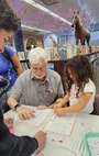 Technical Writer Michael King, a Strategic Weapons Facility, Atlantic (SWFLANT) employee, guides students in coding their names onto a candy cane ornament at the Camden County Public Library in Kingsland, Ga., on Dec. 17, 2025.  SWFLANT hosted a STEM Story Time event at the library where K-12 students learned about basic coding principles and how to apply them to real-life naval operations.

SWFLANT is one of two sites responsible for the Navy’s strategic assets. Its mission is to deliver safe, secure and effective sea-based strategic deterrence to Ohio-class ballistic missile submarines. The command also supports the reconfigured guided missile submarines, which carry Tomahawk cruise missiles.