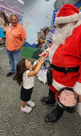 Technical Writer Jeff Chafin, a Strategic Weapons Facility, Atlantic employee, visits students as “STEM Santa” at the Camden County Public Library in Kingsland, Ga., on Dec. 17, 2025. Chafin handed real candy canes to students for their coding efforts at SWFLANT’s STEM Story Time event. 

SWFLANT is one of two sites responsible for the Navy’s strategic assets. Its mission is to deliver safe, secure and effective sea-based strategic deterrence to Ohio-class ballistic missile submarines. The command also supports the reconfigured guided missile submarines, which carry Tomahawk cruise missiles.