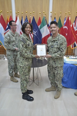 CAPTAIN Raynese Roberts, Commanding Officer, U.S. Naval Hospital Naples, presents the Primary Care Medical Home Certificates to CDR Paolo Acedera; Branch Health
Clinic Capodichino.