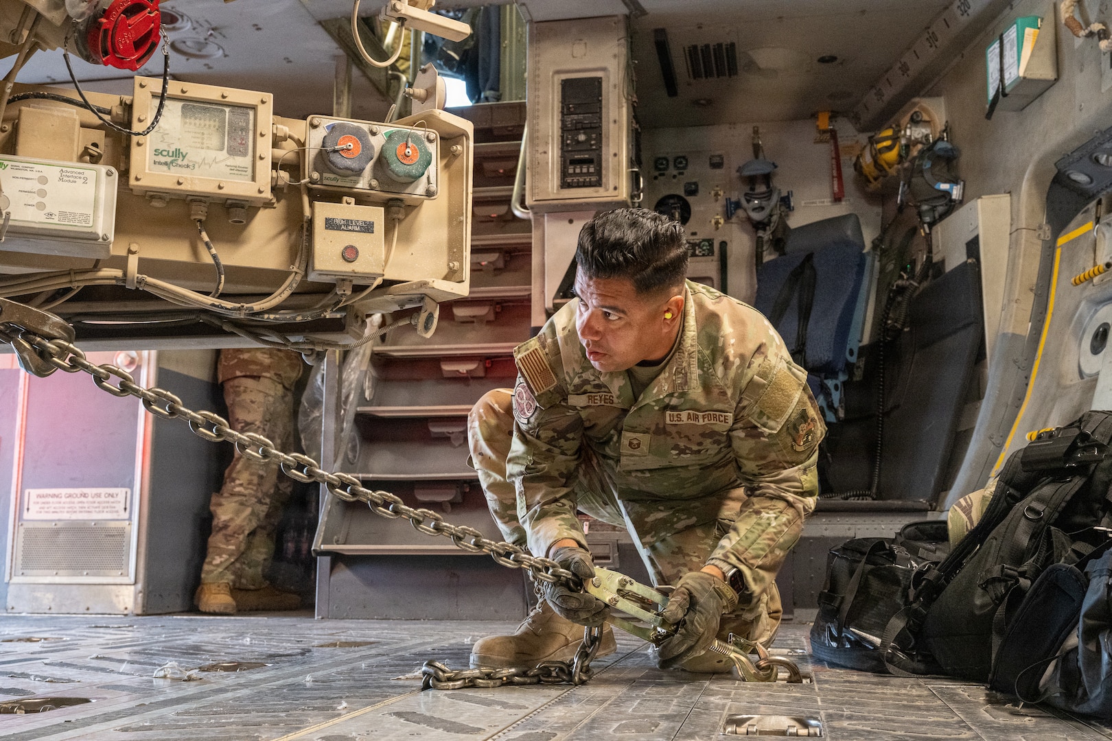 U.S. Air Force Master Sgt. Jose Reyes, 379th Expeditionary Aerial Port Squadron air transportation technician, secures an R-11 refuel truck to the cargo bay floor of a C-17 Globemaster III aircraft during a readiness exercise within the U.S. Central Command area of responsibility Jan. 22, 2026. Throughout the exercise, Airmen honed tactics, techniques and procedures, strengthening the U.S. Air Force’s ability to disperse quickly, establish austere sites, and generate combat sorties with a minimal footprint. (U.S. Air Force photo by Tech. Sgt. Justin Norton)
