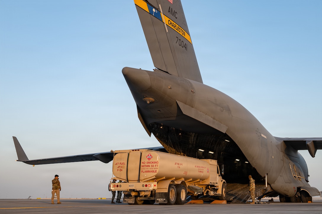 U.S. Airmen assigned to the 379th Expeditionary Aerial Port Squadron and 16th Expeditionary Airlift Squadron load two R-11 refueler trucks onto a C-17 Globemaster III aircraft during a readiness exercise within the U.S. Central Command area of responsibility, Jan. 22, 2026. The exercise spanned across the CENTCOM area of responsibility, elevating readiness with realistic scenarios that tested dispersed operations, rapid deployment of aircraft, and positive control over a large area. (U.S. Air Force photo by Tech. Sgt. Justin Norton)