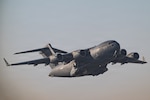 A C-17 Globemaster III aircraft takes off during a readiness exercise within the U.S. Central Command area of responsibility Jan. 22, 2026. The exercise is designed to strengthen Ninth Air Force’s (Air Forces Central) ability to disperse combat airpower throughout the CENTCOM area of responsibility, adding strategic ambiguity to adversary decision making. (U.S. Air Force photo by Tech. Sgt. Justin Norton)