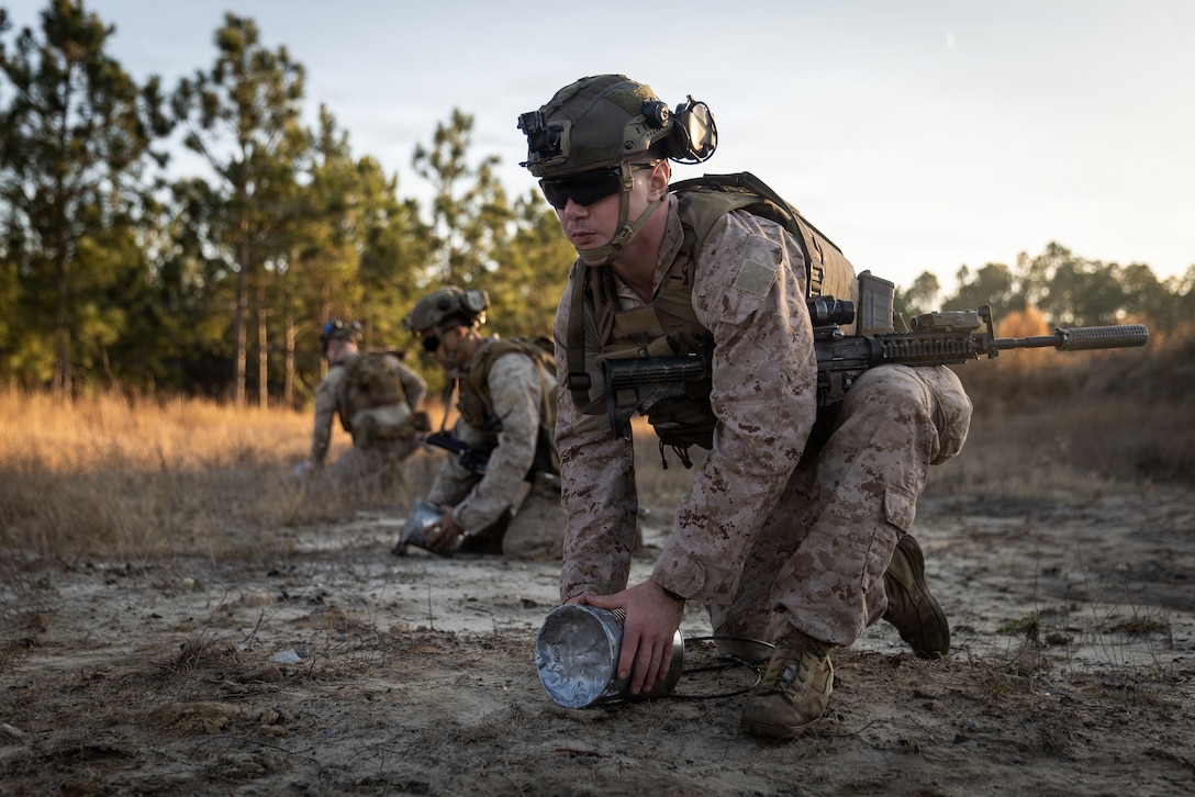 U.S. Marines with 3rd Battalion, 2nd Marine Regiment, 24th Marine Expeditionary Unit place a hasty grapeshot during a demolition range on Marine Corps Base Camp Lejeune, North Carolina, Jan. 7, 2026. The purpose of the range was to maintain and assess the ability of combat engineers attached to the 24th MEU to construct and employ expedient and manufactured demolitions. (U.S. Marine Corps photo by Lance Cpl. Brian Bolin Jr.)