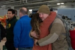 U.S. Air National Guard Tech. Sgt. Anthony O’Tool, a fuels management craftsman with the 185th Air Refueling Wing, hugs his wife on his return from a deployment at the 185th Air Refueling Wing in Sioux City, Iowa, Jan. 25, 2026. The Airmen were deployed to the U.S. Central Command area of responsibility Photo by Staff Sgt. Tylon Chapman.