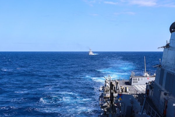 U.S. Navy Arleigh Burke-class guided-missile destroyer USS John Finn (DDG 113) sails in formation with Philippine Navy Jose Rizal-class frigate BRP Jose Rizal (FF-150) during the Maritime Cooperative Activity (MCA) in the Philippines’ Exclusive Economic Zone, Jan. 26, 2026.