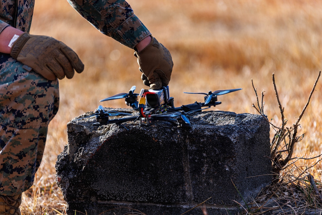 U.S. Marine Corps Lance Cpl. Bryen Z. Martinez, a military police officer with the Counter-Unmanned Aerial System’s Counter-Drone Team, sets up a clay pigeon drone during a C-UAS demo at The Basic School on Marine Corps Base Quantico, Virginia, Jan. 15, 2026. MCB Quantico’s Provost Marshal Office C-UAS Counter-Drone Team showcase tactics and technologies that counter aerial threats. (U.S. Marine Corps photo by Lance Cpl. Donovan E. Melendez)